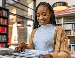 a woman shopping for vinyls