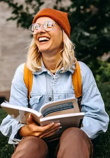 a young woman reading a book